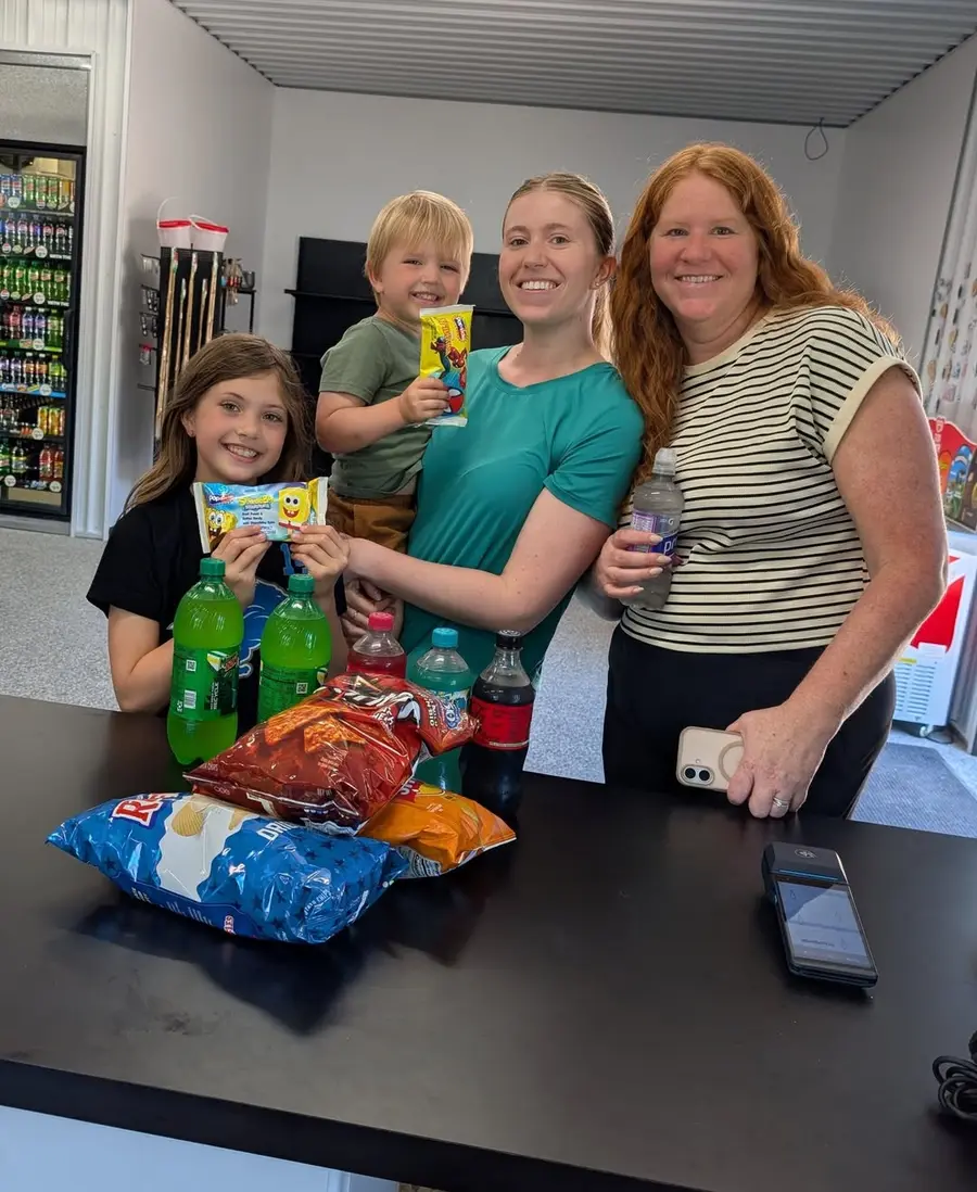 A family checking out at the counter